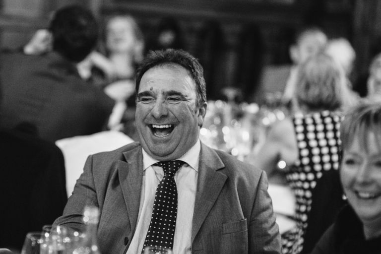 rhinefield house hotel hampshire wedding photographer guest laughing