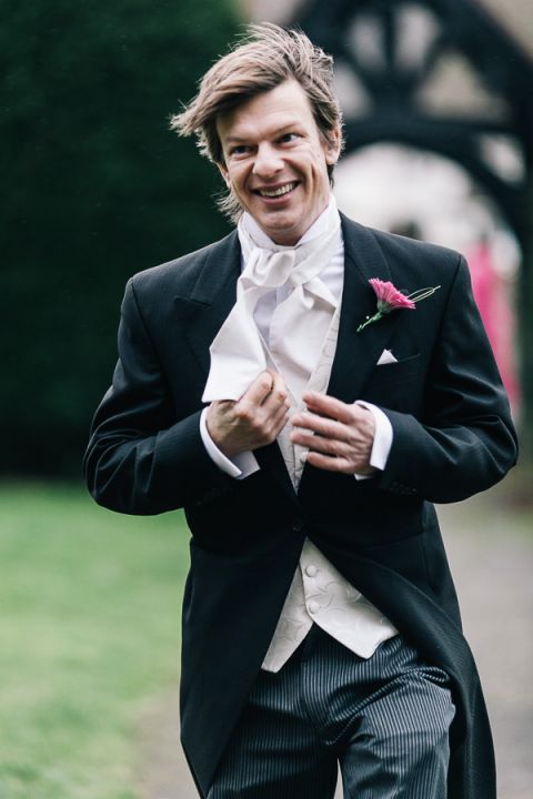 rhinefield house hotel hampshire wedding photographer guest rushing to wedding