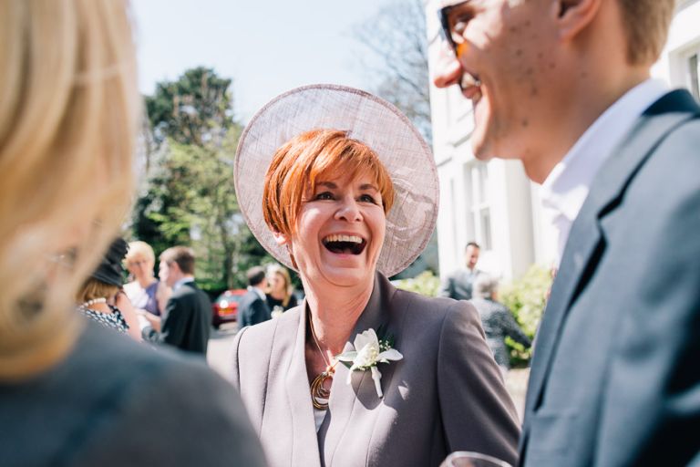Green House Hotel Bournemouth Wedding Photographer guest with hotel laughing again