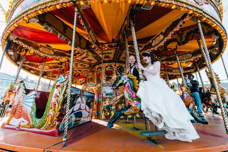 Green House Hotel Bournemouth Wedding Photographer bride and groom dancing on carousel