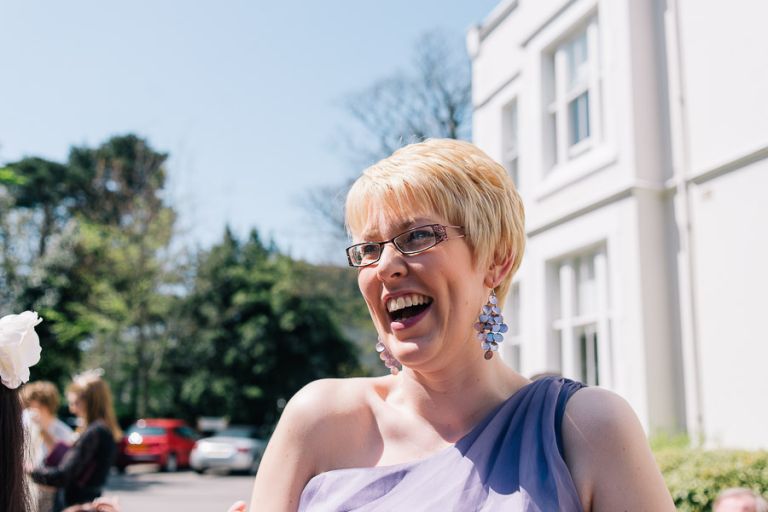 Green House Hotel Bournemouth Wedding Photographer guest with hotel laughing