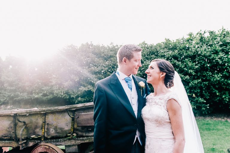 Lillebrooke Manor Wedding Bride and groom portrait by cart