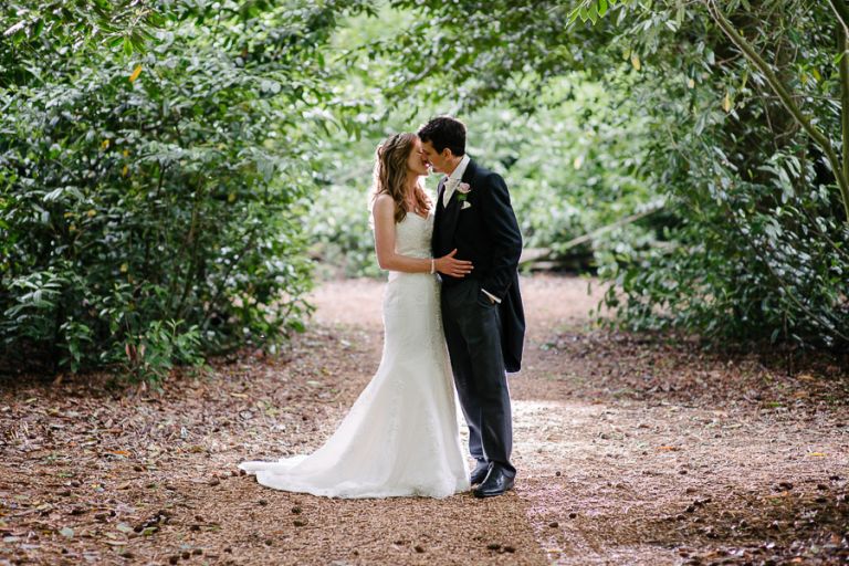 Carly and Justin Kissing at a Larmer Tree Gardens Wedding