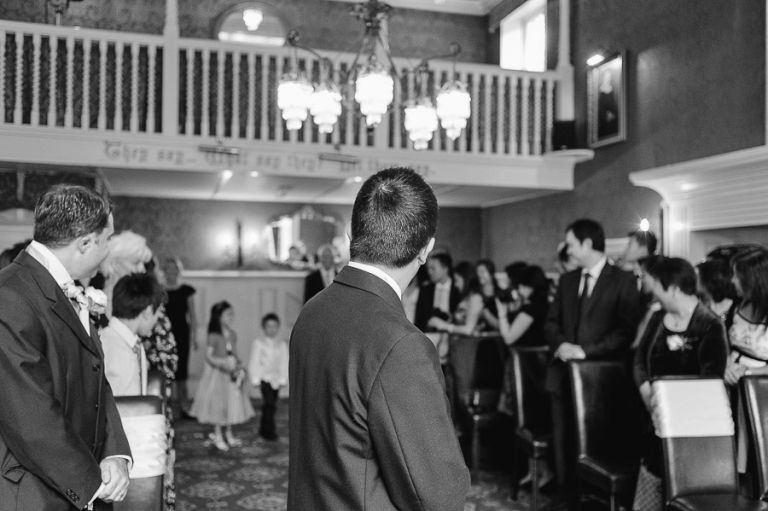 Langtry Manor Hotel Bournemouth Groom turning to see bridesmaids