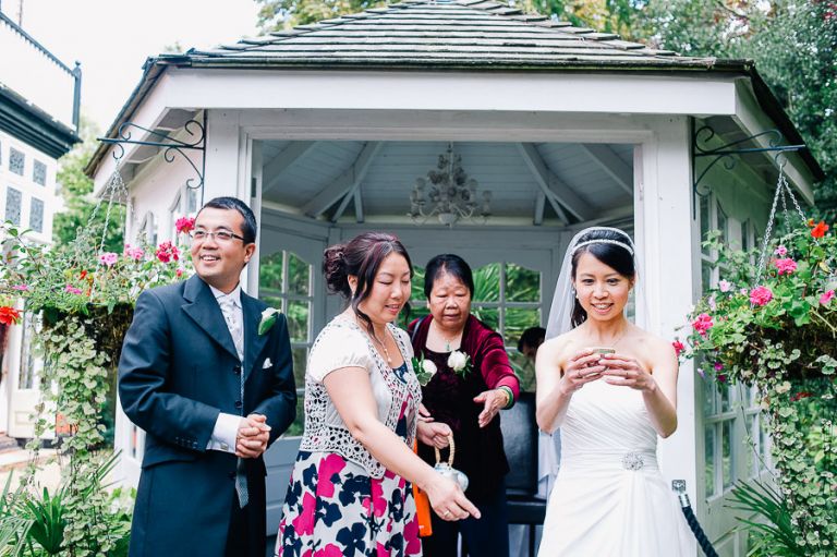 wedding chinese tea ceremony tea being offered outside at Langtry Manor Hotel Bournemouth