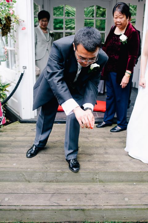 wedding chinese tea ceremony tea being offered to the ground at Langtry Manor Hotel Bournemouth