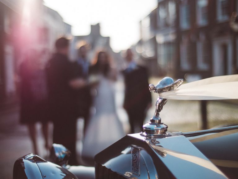 wedding at poole guildhall bridal car with bride in background