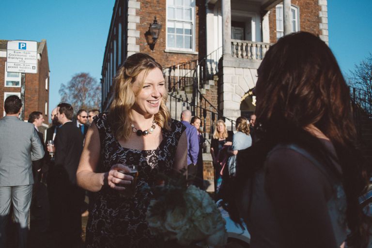 Guest talking to other guests outside Poole Guildhall