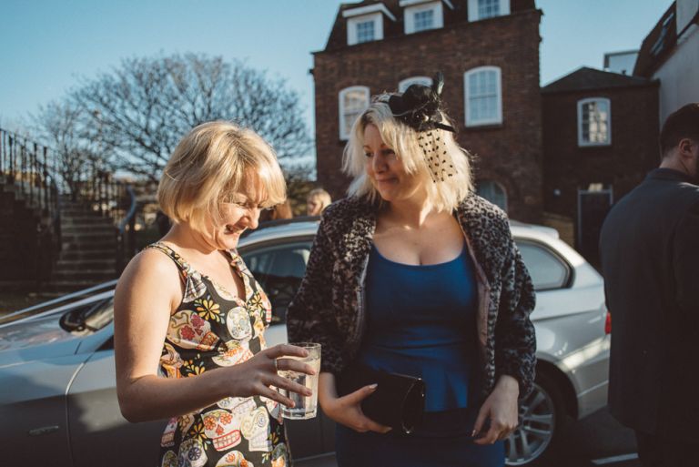 couple chatting at wedding at poole guildhall