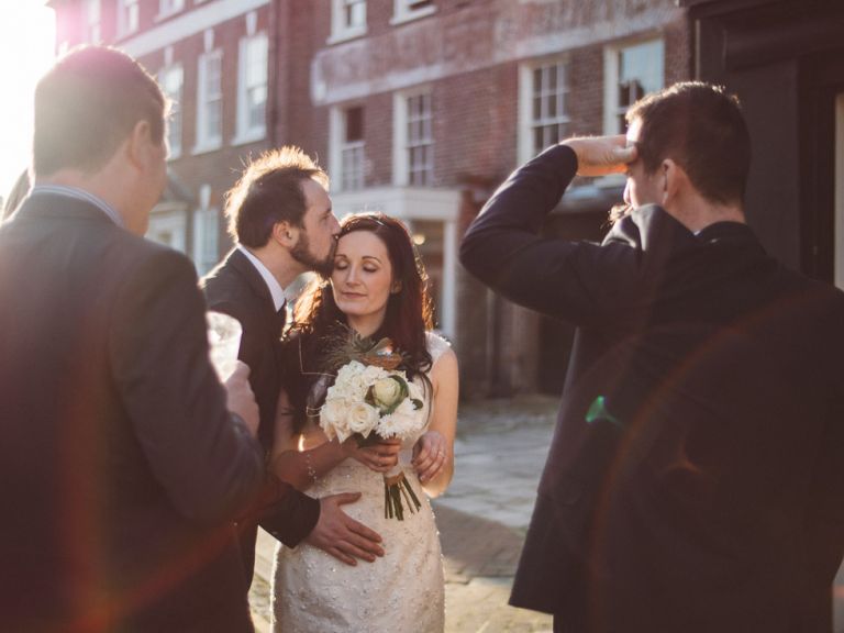 wedding couple at poole guildhall sharing a tender moment