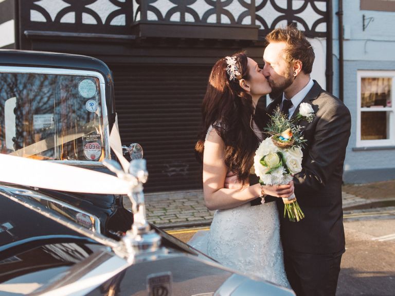 wedding couple at poole guildhall by car