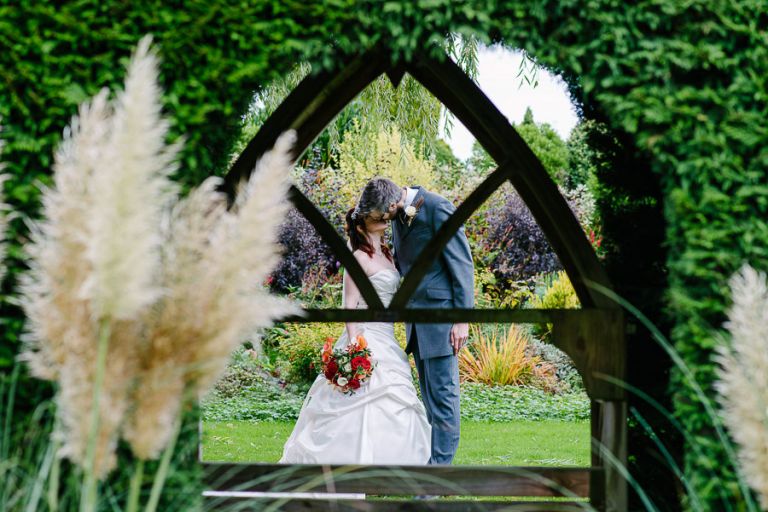 bride and groom at autumnal wedding at orangery wimborne