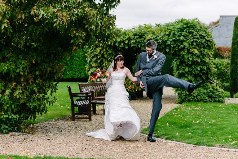 high kicks at autumnal wedding at orangery wimborne