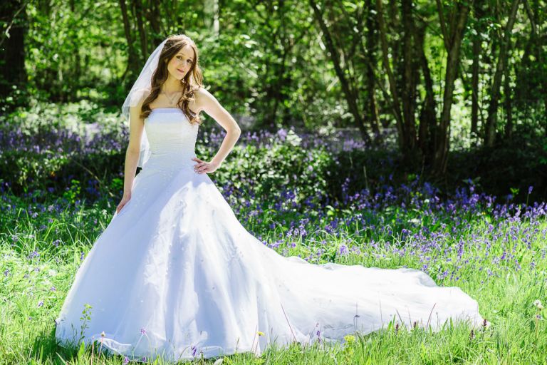 beautiful bride in the bluebells at weddings at the Old Vicarage christchurch