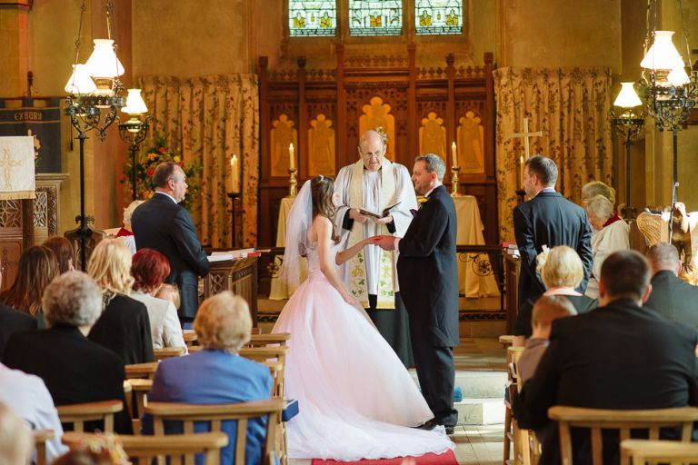 weddings at the Old Vicarage christchurch an new forest - bride and groom exchanging vows during ceremony
