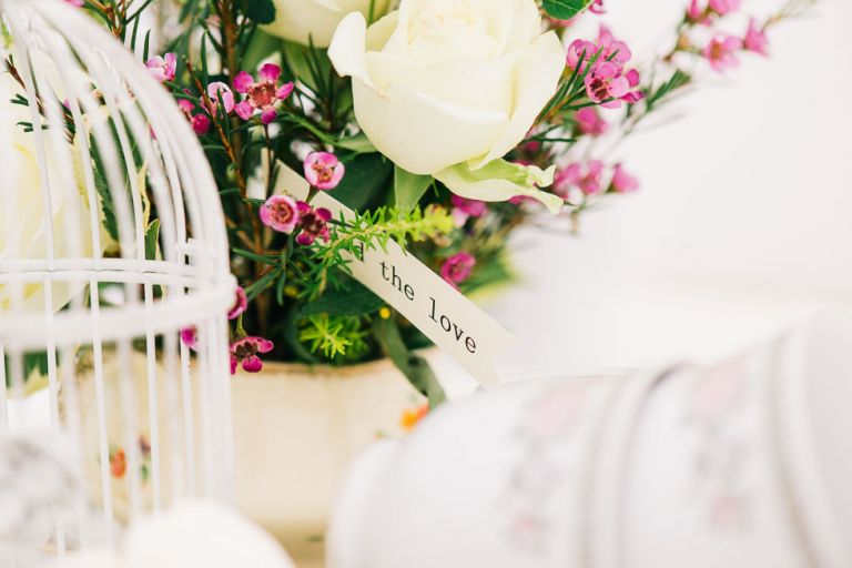 dorset garden marquee wedding details flowers in vintage china teacups