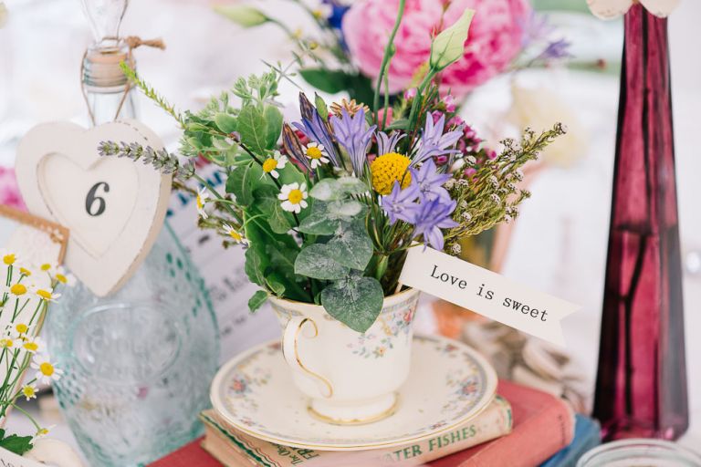 dorset garden marquee wedding details flowers in vintage china teacups