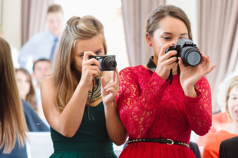 weddings-at-deans-court-wimborne-wedding-photographer-guests taking photos