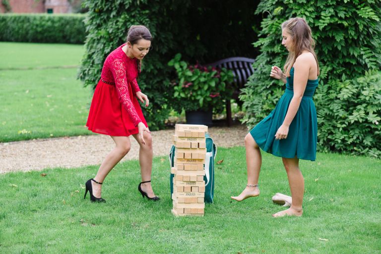 weddings-at-deans-court-wimborne-wedding-photographer-guests playing jenga