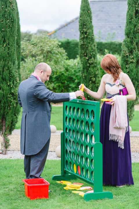 weddings-at-deans-court-wimborne-wedding-photographer-guests playing connect 4