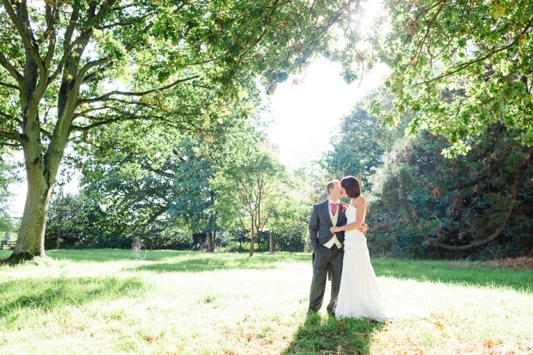 weddings-at-deans-court-wimborne-wedding-photographer bride and groom portraits in sunshine