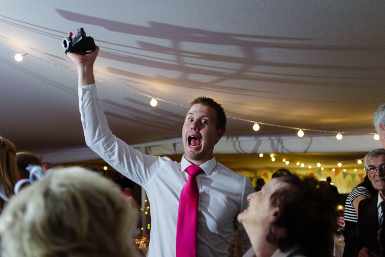 weddings-at-deans-court-wimborne-wedding-photographer guests partying