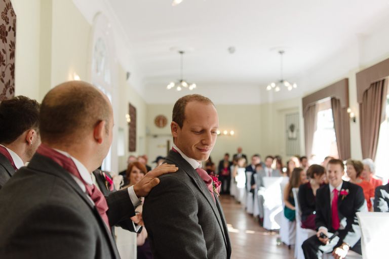 weddings-at-deans-court-wimborne-wedding-photographer-groom waiting for bride