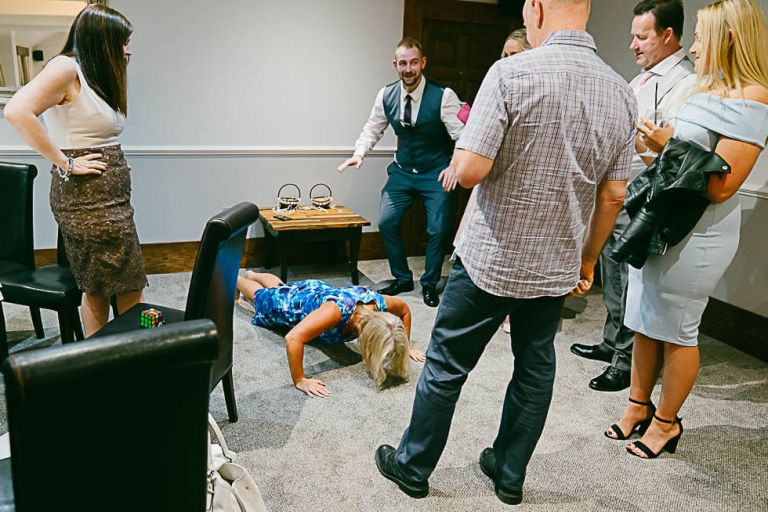 guest doing pressups at the balmer lawn hotel at a wedding